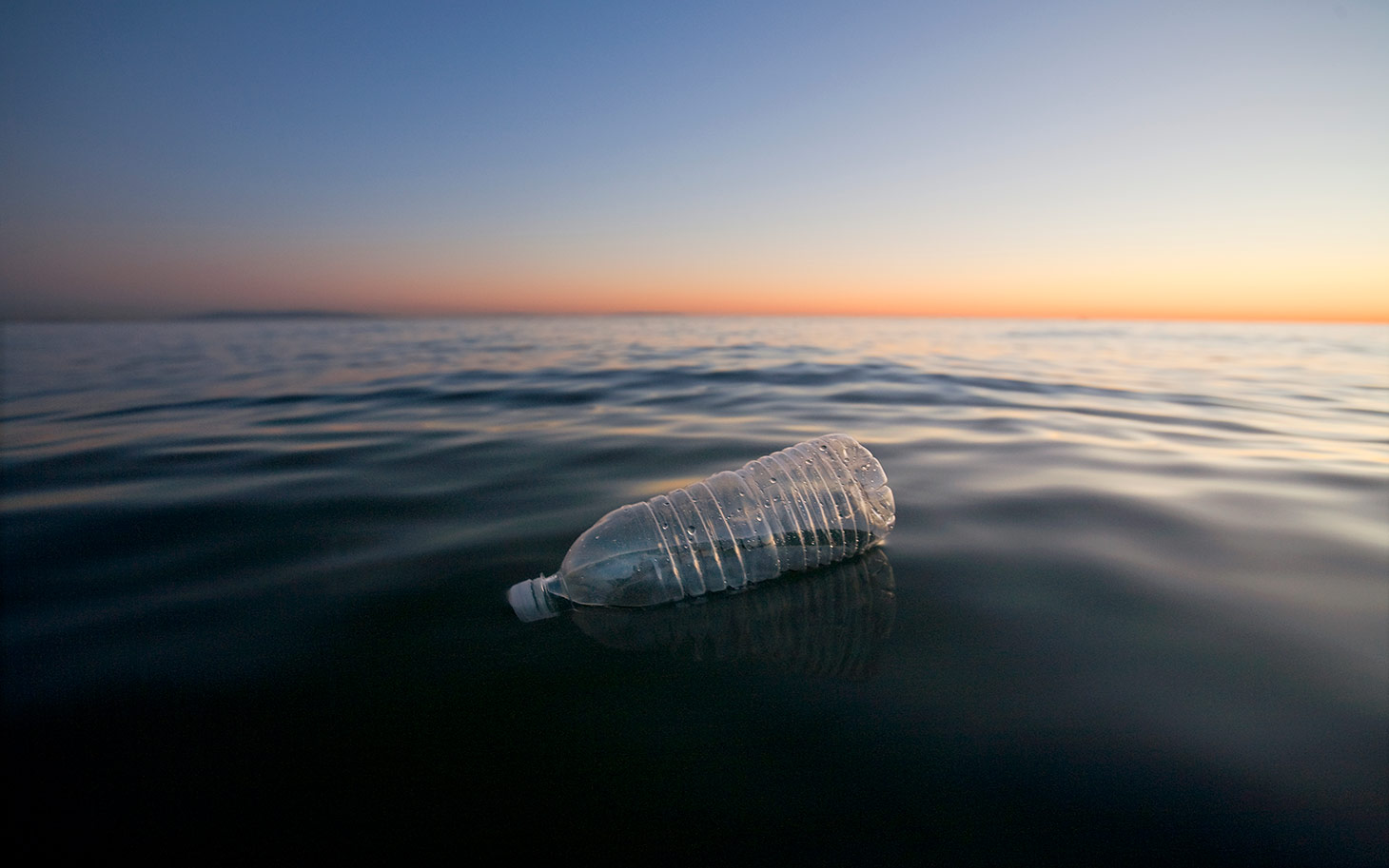 Plastic bottle floating in ocean
